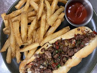 Product: shaved ribeye, sautéed onions & peppers,
american cheese, hoagie roll - SKYBOKX 109 Sports Bar & Grill in Across from the Natick Mall - Natick, MA American Restaurants