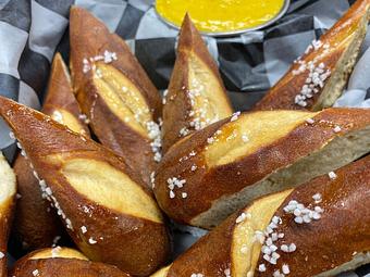 Product: pretzel bites, drizzled honey
house-made beer mustard - SKYBOKX 109 Sports Bar & Grill in Across from the Natick Mall - Natick, MA American Restaurants