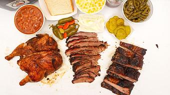 Product: Family Pack with Brisket, Chicken and Pork Ribs and Pinto Beans, Creamed Corn and Green Beans - Smokey Mo’s BBQ in New Braunfels, TX Barbecue Restaurants