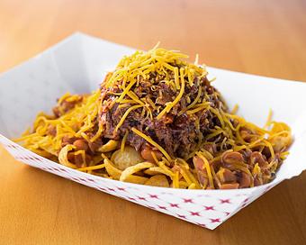 Product: Frito Pie with Frito Corn Chips, Pinto Beans, Chop and Cheddar Cheese - Smokey Mo’s BBQ in New Braunfels, TX Barbecue Restaurants