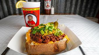 Product: Chopped Baker with Butter, Sour Cream, Cheddar Cheese and Chives and Iced Tea - Smokey Mo’s BBQ in New Braunfels, TX Barbecue Restaurants