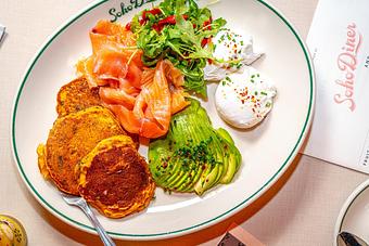 Product: Sweet corncakes with smoked salmon, avocado, and poached eggs - Soho Diner in SoHo, NY - New York, NY Diner Restaurants