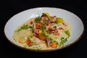 Product: Lobster Ravioli
Sautéed shrimp, red peppers, green onions, cherry tomatoes, baby arugula tossed in Spanish sherry cream, fine herbs & pink 
peppercorns - Stables Ranch Grille - Restaurant-Reservations in Tubac, AZ American Restaurants