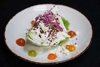 Product: Wedge
Iceberg, heirloom tomatoes, gastrique onions, bacon and creamy bleu cheese dressing - Stables Ranch Grille - Restaurant-Reservations in Tubac, AZ American Restaurants