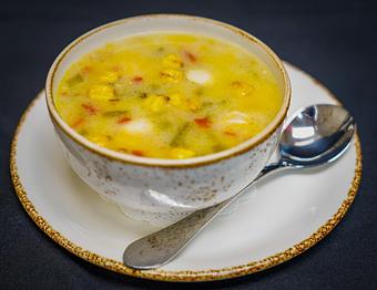 Product: Turkey & Green Chili Soup 
Roasted turkey and green chilies, masa dumplings, caramelized onions,
toasted almonds and AZ chicos - Stables Ranch Grille - Restaurant-Reservations in Tubac, AZ American Restaurants