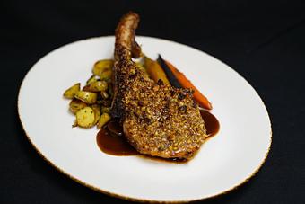 Product: Tomahawk Pork Chop 12 oz
Walnut-brown sugar crust, brown mustard glaze, sunchoke, chayote & fingerling hash 
and rainbow carrots - Stables Ranch Grille - Restaurant-Reservations in Tubac, AZ American Restaurants