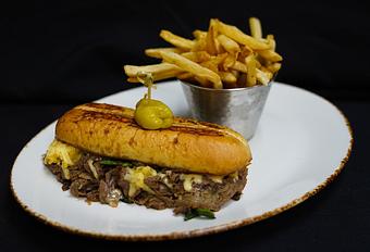 Product: SHAVED PRIME RIB SANDWICH
Caramelized onions, poblano chilies, and manchego cheese on a toasted hoagie roll - Stables Ranch Grille - Restaurant-Reservations in Tubac, AZ American Restaurants