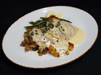 Product: Pork Schnitzel
Lemon caper butter, german potato salad with applewood bacon, and sautéed haricot verts - Stables Ranch Grille - Restaurant-Reservations in Tubac, AZ American Restaurants