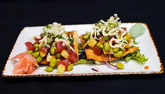 Product: Tuna Poke Tostadas
Fried wontons, cucumber, cabbage escabeche, edamame, mango salsa, Korean chili aioli, wasabi & gari shoga - Stables Ranch Grille - Restaurant-Reservations in Tubac, AZ American Restaurants