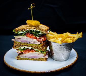 Product: Ranch Club
Seedlover wheat bread, Dijon-mayo, guacamole, turkey, ham, bacon, Jarlsberg swiss, lettuce, tomatoes - Stables Ranch Grille - Restaurant-Reservations in Tubac, AZ American Restaurants