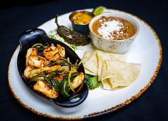 Product: Baja Camarón
Skillet-seared shrimp, charred peppers and onions, pineapple-mango salsa, tomatillo guacamole & queso fresco - Stables Ranch Grille - Restaurant-Reservations in Tubac, AZ American Restaurants