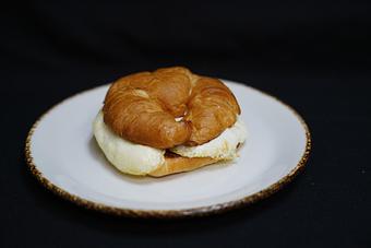 Product: Croissant Sandwich
Two eggs any style with smoked ham, and Jarlsberg swiss cheese, sandwiched in a toasted croissant - Stables Ranch Grille - Restaurant-Reservations in Tubac, AZ American Restaurants