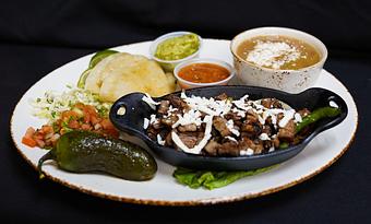 Product: Achiote Rubbed Carne Asada
Grilled skirt steak, charred peppers and onions, barbacoa salsa, queso fresco, and tomatillo guacamole - Stables Ranch Grille - Restaurant-Reservations in Tubac, AZ American Restaurants