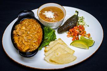 Product: Carnitas Hacienda
Braised pork and green chilies, cotija cheese, cabbage escabeche, pico de gallo, warm flour tortillas, chili toreado and frijoles charros - Stables Ranch Grille - Restaurant-Reservations in Tubac, AZ American Restaurants