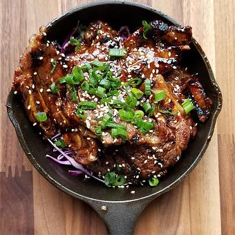 Product: Galbi Short Ribs(GF) (Korean marinated beef ribs topped with green onions and sesame seeds) - Station 16 in Sacramento, CA Bars & Grills
