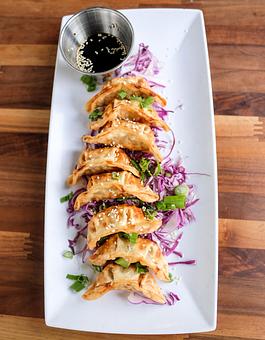 Product: Fried chicken dumplings with a citrus soy sauce - Station 16 in Sacramento, CA Bars & Grills