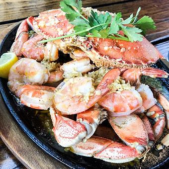 Product: The Small Mix (Dungeness crab and prawns roasted in our roasted garlic butter sauce. (Serves 2) - Station 16 in Sacramento, CA Bars & Grills