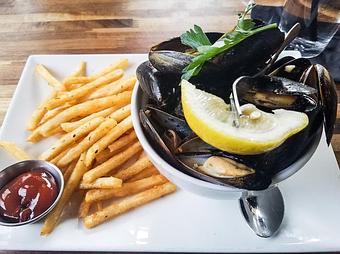 Product: Mussels and Fries (Pei mussels in Cajun garlic butter broth. Served with crispy fries) - Station 16 in Sacramento, CA Bars & Grills