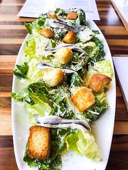 Product: Caesar Salad (Romaine, anchovies, croutons and Parmesan) - Station 16 in Sacramento, CA Bars & Grills