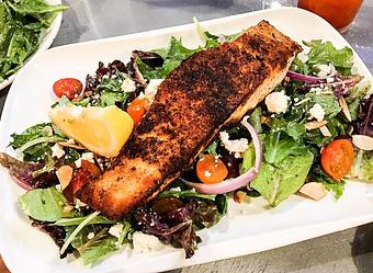 Product: Salmon Salad (Mixed greens, feta, shallots, almonds, tomatoes and citrus vinaigrette) - Station 16 in Sacramento, CA Bars & Grills