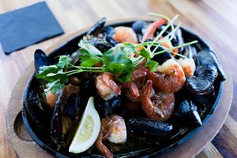 Product: Build your own skillet, or single item. Choose from Prawns, King Crab, Snow Crab, Mussels, Dungeness Crab, and Clams. - Station 16 in Sacramento, CA Bars & Grills