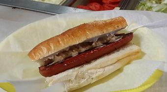 Product: 100% all Beef Dog grilled to perfection. Served on hot dog roll - Surfwiches Sandwich Shop in Jacksonville Beach - Jacksonville Beach, FL American Restaurants