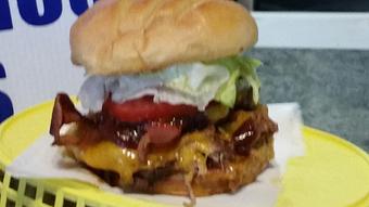 Product: Twin Angus patties seasoned and seared to perfection, pulled pork, bbq sauce, apple-wood smoked bacon. Lettuce, tomato, garlic peppercorn mayonnaise, Cheddar Cheese. - Surfwiches Sandwich Shop in Jacksonville Beach - Jacksonville Beach, FL American Restaurants