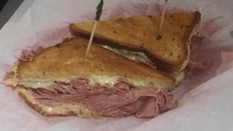 Product: 100 % All Natural Corned Beef Cut thinly sliced & Grilled Swiss Cheese with Sauerkraut Thousand Island dressing on Grilled Rye bread - Surfwiches Sandwich Shop in Jacksonville Beach - Jacksonville Beach, FL American Restaurants