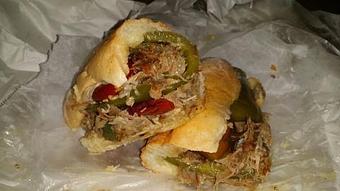 Product: Garlic & Rosemary pulled pork with roasted peppers - Surfwiches Sandwich Shop in Jacksonville Beach - Jacksonville Beach, FL American Restaurants