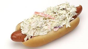 Product: All Beef Frank on a hot dog roll Mustard, raw onions, homemade Coleslaw - Surfwiches Sandwich Shop in Jacksonville Beach - Jacksonville Beach, FL American Restaurants