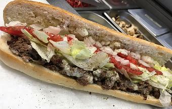 Product: Rib-eye or Chicken, seasoned and seared to perfection finished with Lettuce, tomato, raw onion, S & P, oregano and Garlic Peppercorn Mayo. Sweet or Hot peppers are recommended - Surfwiches Sandwich Shop in Jacksonville Beach - Jacksonville Beach, FL American Restaurants