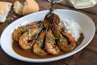 Product: Jumbo Gulf shrimp in a New Orleans style BBQ sauce spiked with local beer and served over stone-ground grits - Tableau in French Quarter - New Orleans, LA Restaurants/Food & Dining