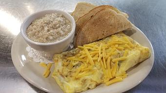 Product: Ham & Cheddar Omelet with a side of Oatmeal - Tallchief Diner in Irving, NY Diner Restaurants