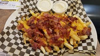 Product: French Fries topped with cheese & bacon - Tallchief Diner in Irving, NY Diner Restaurants