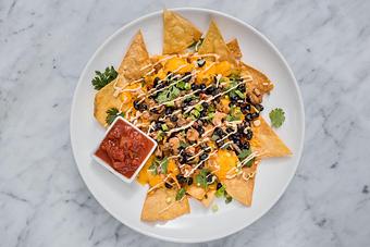 Product: Sautéd Louisiana crawfish with black beans, remoulade sauce, Cheddar cheese and jalapeños with tortilla chips.   Tempt Restaurant - New Orleans French Quarter - Tempt in French Quarter / CBD - New Orleans, LA American Restaurants