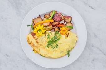 Product: Add your choice of ingredients. Served with a side of hash brown potatoes.   Tempt Restaurant - New Orleans French Quarter - Tempt in French Quarter / CBD - New Orleans, LA American Restaurants