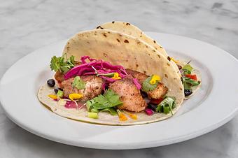 Product: Cajun blackened catch of the day with black bean medley and topped with Tempt slaw. Served on 2 flour tortillas..   Tempt Restaurant - New Orleans French Quarter - Tempt in French Quarter / CBD - New Orleans, LA American Restaurants