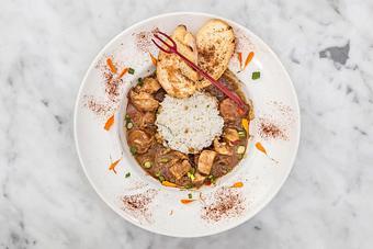 Product: Fresh catch of the day fried in a spicy Zapp's Voodoo chip batter and topped with a creole remoulade sauce. Served dressed on local French bread with fries..   Tempt Restaurant - New Orleans French Quarter - Tempt in French Quarter / CBD - New Orleans, LA American Restaurants