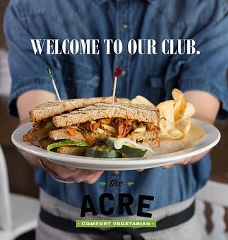Product: Toasted multi-grain double decker with carrot bacon, avocado, green chile, lettuce, tomato, and chipotle mayo. Served with house made potato chips and pickles. - The Acre in Albuquerque, NM American Restaurants