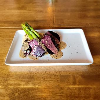 Product: Pepper-crusted grilled beet, pepercorn sauce, mashed potatoes, and asparagus. Served with choice of soup or salad. - The Acre in Albuquerque, NM American Restaurants