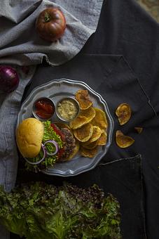 Product: classic Krenz burger with lettuce, tomato, onion. Look in the photo gallery for the Krenz Ranch Burger with pimento cheese and with blue cheese. - The Asbury in Uptown Charlotte - Charlotte, NC American Restaurants