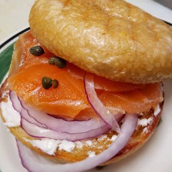Product: OUr scratch-made Bagel with our house cured Lox to make a purist's heart leap!  Bagel, cream cheese, tomato, red onion, and capers! - The Back Door Bakery & Cafe in Sunland, CA American Restaurants