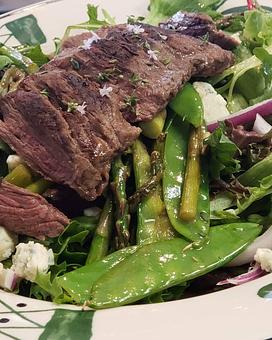 Product: Mixed greens with gorgonzola, red onion,  sauteed asparagus and snow peas, and tender outside cut of skirt steak grilled to a perfect medium rare.  Balsamic Vinaigrette. - The Back Door Bakery & Cafe in Sunland, CA American Restaurants