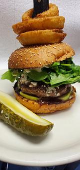 Product: 7 Oz's Organic Ground Lamb, Hand made & seasoned cooked to your preference. Roasted Blackberry Chipotle sauce, sliced granny smith apples, goat cheese crumbles, organic baby spinach leaves, mayo on bun. Half dill pickle on side. - The Bee Hive in Whittier, CA Delicatessen Restaurants