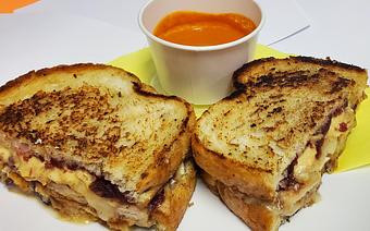 Product: 7 Oz's of Boars Head Oven Roasted Turkey sliced, Brie Cheese, Ocean Spray Whole Berry Cranberry Sauce, Dijon Mustard, MELT.  Side of Tomato Bisque soup - The Bee Hive in Whittier, CA Delicatessen Restaurants