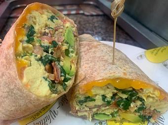 Product: 3 organic cage free eggs, baby spinach sauteed, diced tomatoes, half an avocado, applewood smoked bacon thick cut, melted cheddar.  side of homemade salsa. - The Bee Hive in Whittier, CA Delicatessen Restaurants