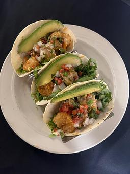 Product: 3 soft tacos stuffed with fried shrimp in a spicy bang bang sauce, pico de gallo, sliced avocado, jalapeno pepper & lettuce. - The Bowman in Parkville, MD American Restaurants