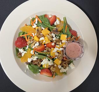 Product: A bed of spinach topped with strawberry, walnut, orange, goat cheese, mango, and
raisin finished with a raspberry-lime vinaigrette. - The Bowman in Parkville, MD American Restaurants