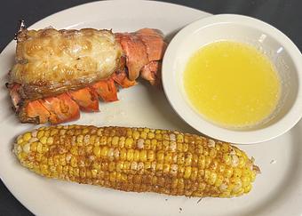 Product: Served with Old Bay corn on the cob and clarified lemon-butter. - The Bowman in Parkville, MD American Restaurants