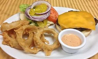 Product: Caboose Burger with Cheese and Onion Rings - The Caboose Restaurant in Located in Beautiful Downtown McComb - McComb, MS Cajun & Creole Restaurant